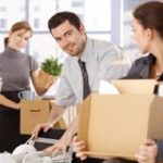 office relocation prep, the team packs moving boxes in the office